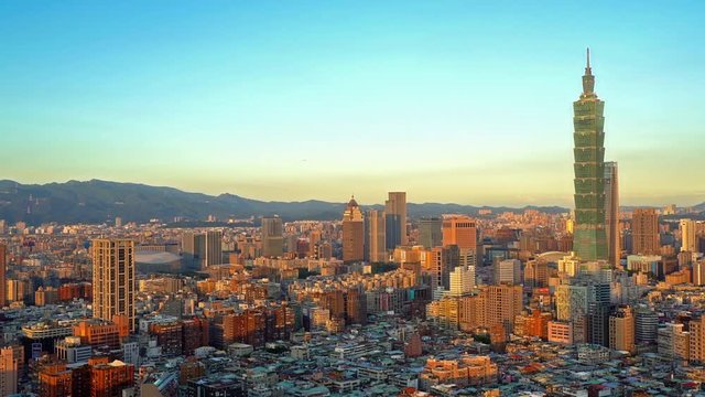 Pan of Taipei Taiwan skyline during sunset