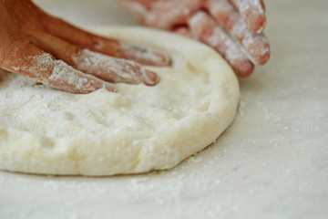 Stretching pizza dough 