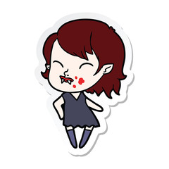 sticker of a cartoon vampire girl with blood on cheek