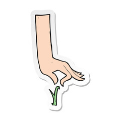 sticker of a cartoon hand picking blade of grass