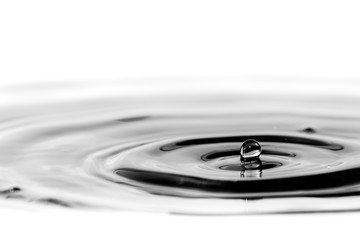 Water droplet splash background texture isolated on white. Fresh clean pure water ripples and...