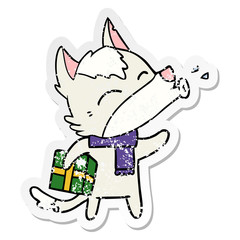 distressed sticker of a howling wolf with christmas present