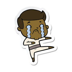 sticker of a cartoon man crying