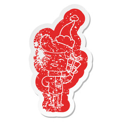 cartoon distressed sticker of a man laughing wearing santa hat