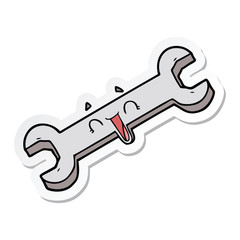 sticker of a cartoon laughing spanner