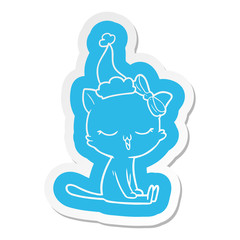 cartoon  sticker of a cat with bow on head wearing santa hat