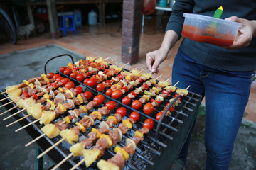 Barbeque Grill Street Food in thailand,Eat outdoors in a happy family.