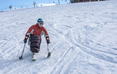 disabled athlete and  Winter Sport,  handicapped person and Mono Ski, handicapped athlete goes mono...