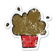distressed sticker of a cartoon cupcake