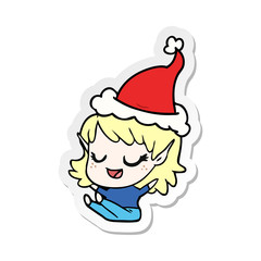 happy sticker cartoon of a elf girl sitting wearing santa hat