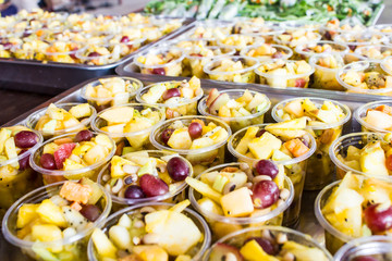 close up fresh fruit salad in plastic cup for weight loss