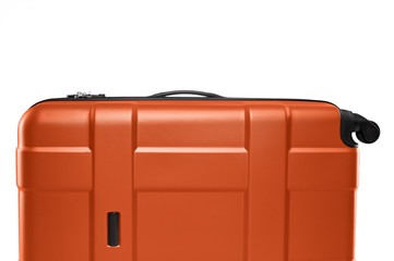 Fragment of orange plastic valise on wheels isolated on white background