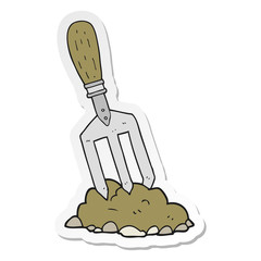 sticker of a cartoon garden fork