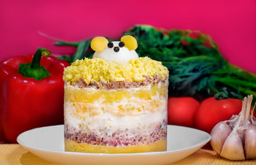 Mimosa salad with cheese mouse. Traditional Russian festive salad Mimoza. Year of the Mouse 2020. Selective focus.