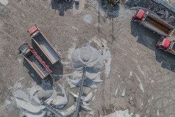 Obraz premium Aerial view of crushed stone quarry machine in a construction material factory 
