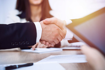 Business people shaking hands at meeting or negotiation in the office. Handshake concept. Partners are satisfied because signing contract