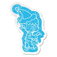 worried cartoon distressed sticker of a boy wearing santa hat