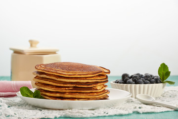 Fototapeta na wymiar pancakes with fruit and maple syrup
