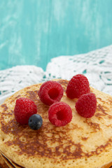 pancakes with fruit and maple syrup