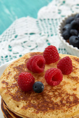 pancakes with fruit and maple syrup