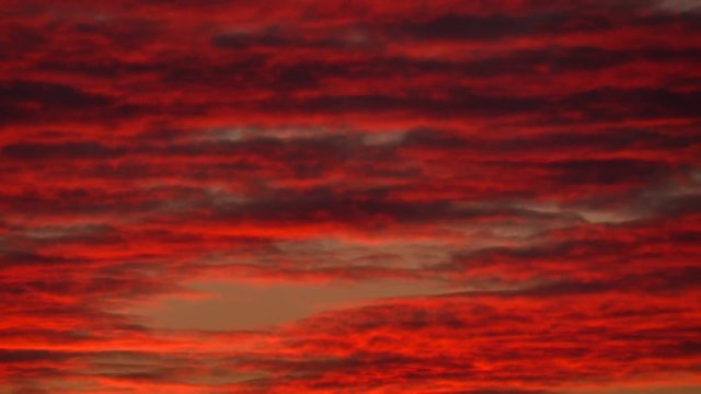 Orange sunset sky and drak clouds nature timelapse background.