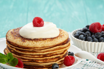 pancakes with fruit and maple syrup