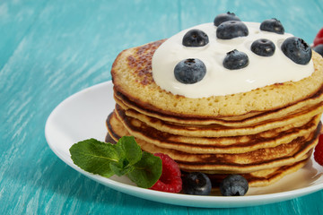 pancakes with fruit and maple syrup