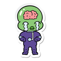 sticker of a cartoon big brain alien crying