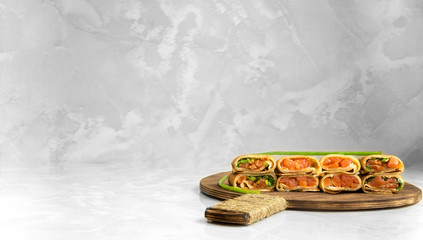 pancakes with red fish and green onions