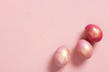 Banner with pink Easter eggs with golden spots