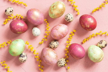 Pattern with pink Easter eggs with golden spots and flowers