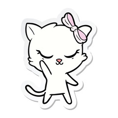 sticker of a cute cartoon cat with bow