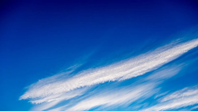 Deep Blue Sky Cirrus Clouds Timelapse, Nature Background Cloudscape Fly Across Through Heaven, 4K Video