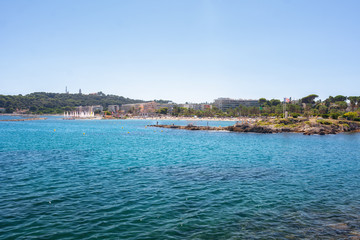 View of the beach Du Ponteil of the town Antibes.