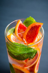 Mojito with red oranges. Selective focus. Shallow depth of field.