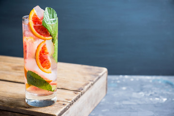 Mojito with red oranges. Selective focus. Shallow depth of field.