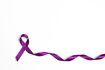 Purple epilepsy awareness ribbon on a white background with copy space.