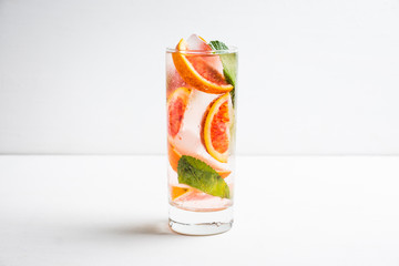 Mojito with red oranges. Selective focus. Shallow depth of field.