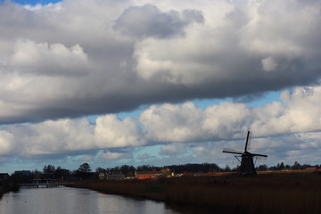 Fototapeta na wymiar windmill of kinderdijk , beautiful netherlands landscape with sky and clouds background, historical travel photo