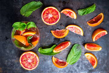 Bloody oranges beverage with mint. Selective focus. Shallow depth of field.