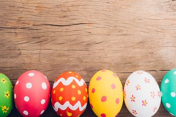 Beautiful Easter multi color egg on wooden