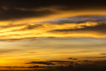 Beautiful golden sunshine reflect and spread with sky and dark cloud at asia