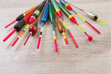 Fishing floats on a wooden table © yrafoto