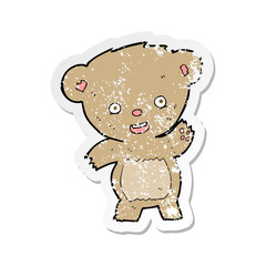 retro distressed sticker of a cartoon waving teddy bear