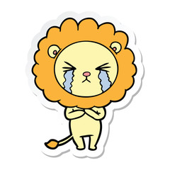 sticker of a cartoon crying lion
