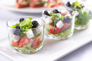 Beautifully decorated Banquet table with snacks, canapes, sandwiches, fresh vegetables, birthday, corporate event or wedding celebration