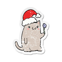 distressed sticker of a cute cartoon christmas cat