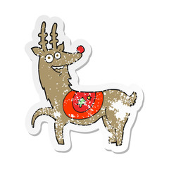 retro distressed sticker of a cartoon christmas reindeer