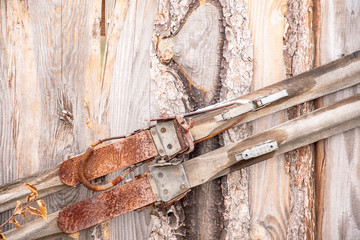 old rusty wooden cross-country skis on a wooden wall