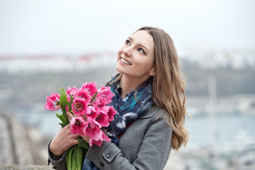 Woman with tulips. Beautiful woman with flowers.